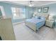 Bright bedroom with ocean view featuring blue and white decor and a ceiling fan at 3311 S Atlantic Ave # 801, Daytona Beach, FL 32118
