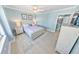 Bedroom featuring ocean-themed decor, with a partial view into the kitchen at 3311 S Atlantic Ave # 801, Daytona Beach, FL 32118