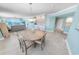 Dining area featuring ocean views, modern lighting, and seamless access to the living room at 3311 S Atlantic Ave # 801, Daytona Beach, FL 32118