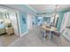 Charming dining area with kitchen access, complemented by views of the bedroom and ample natural light at 3311 S Atlantic Ave # 801, Daytona Beach, FL 32118