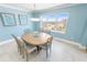Dining room with seating for six and a large picture window offering beautiful city views at 3311 S Atlantic Ave # 801, Daytona Beach, FL 32118