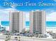 DiMucci Twin Towers oceanfront condos with beautiful views of the beach, palm trees, and coastal highway at 3311 S Atlantic Ave # 801, Daytona Beach, FL 32118