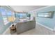 Living room showcasing ocean views from floor to ceiling windows and a seamless flow to balcony at 3311 S Atlantic Ave # 801, Daytona Beach, FL 32118