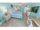 Relax in this ocean view main bedroom, featuring cool colors and a calming coastal decor at 3311 S Atlantic Ave # 801, Daytona Beach, FL 32118
