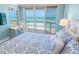 Ocean view Primary bedroom with private balcony access. A work space and TV makes this room complete at 3311 S Atlantic Ave # 801, Daytona Beach, FL 32118