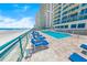 Relax by the beachfront pool and lounge area, with stunning views of the ocean and nearby condos at 3311 S Atlantic Ave # 801, Daytona Beach, FL 32118