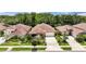 Aerial view of a well-maintained neighborhood showcasing single-Gathering homes and lush landscaping at 3376 Leonardo Ln, New Smyrna Beach, FL 32168