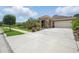 Attractive single-Gathering home with well-manicured landscaping, a spacious driveway, and an attached two-car garage at 3376 Leonardo Ln, New Smyrna Beach, FL 32168