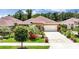 Charming single-story home featuring lush landscaping, a well-maintained lawn, and a two-car garage at 3376 Leonardo Ln, New Smyrna Beach, FL 32168