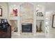 Elegant fireplace featuring stone surround and decorative niches at 3376 Leonardo Ln, New Smyrna Beach, FL 32168