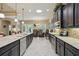 Bright and spacious kitchen with an island, stainless steel appliances, and an open dining area at 3376 Leonardo Ln, New Smyrna Beach, FL 32168