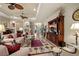 Bright living area featuring comfortable furnishings, ceiling fans, and entertainment center at 3376 Leonardo Ln, New Smyrna Beach, FL 32168