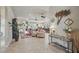 Open-concept living area with tiled flooring, ceiling fans, and stylish decor at 3376 Leonardo Ln, New Smyrna Beach, FL 32168