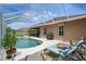 Backyard featuring pool, patio, barbecue area, and a beautifully landscaped surrounding, perfect for entertaining at 3376 Leonardo Ln, New Smyrna Beach, FL 32168