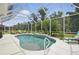 Inviting screened-in pool area with comfortable lounge chairs, perfect for outdoor relaxation at 3376 Leonardo Ln, New Smyrna Beach, FL 32168