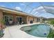Backyard has a large screened-in pool and patio area, perfect for outdoor entertaining and relaxation at 3376 Leonardo Ln, New Smyrna Beach, FL 32168
