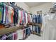 Spacious walk-in closet with extensive shelving and hanging rods for optimal storage at 3376 Leonardo Ln, New Smyrna Beach, FL 32168