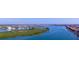 Stunning aerial view of the neighborhood showcasing the waterfront, bridge, and nearby homes at 34 Richmond Dr, New Smyrna Beach, FL 32169