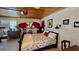 Garage-turned-bedroom featuring wood paneling, a surfboard and desk with bed at 34 Richmond Dr, New Smyrna Beach, FL 32169