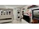 Bunk bedroom with a washer/dryer, built in storage and a television at 34 Richmond Dr, New Smyrna Beach, FL 32169