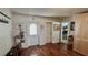 Inviting foyer with hardwood floors, coat rack, and views into other rooms at 34 Richmond Dr, New Smyrna Beach, FL 32169