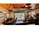 Finished garage featuring wood ceiling and a workspace with a glass garage door and waterfront views at 34 Richmond Dr, New Smyrna Beach, FL 32169