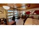 Finished garage featuring wood ceiling and a workspace with a glass garage door and waterfront views at 34 Richmond Dr, New Smyrna Beach, FL 32169