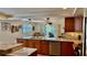 Gourmet kitchen featuring custom cabinets, stainless steel appliances, and marble countertops at 34 Richmond Dr, New Smyrna Beach, FL 32169