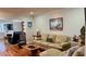 Comfortable living room featuring a plush sofa, hardwood floors, and stylish decor at 34 Richmond Dr, New Smyrna Beach, FL 32169