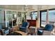 Sunroom featuring comfortable seating, ceiling fan, and sliding glass doors to the outside at 34 Richmond Dr, New Smyrna Beach, FL 32169