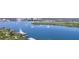 Water view featuring boats and lush vegetation on a sunny day at 34 Richmond Dr, New Smyrna Beach, FL 32169