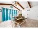 Bright dining area with a farmhouse table, ample seating, and views to the outside at 35 Knollwood Estates Dr, Ormond Beach, FL 32174