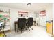A well-lit office space with tile floors, a window, and a full white board for notes at 35 Knollwood Estates Dr, Ormond Beach, FL 32174
