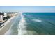 Breathtaking aerial view of the pristine beach and oceanfront condo community at 4151 S Atlantic Ave # 414, New Smyrna Beach, FL 32169