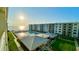 A picturesque beachfront resort with a pool, sun deck, and expansive ocean views at 4151 S Atlantic Ave # 414, New Smyrna Beach, FL 32169