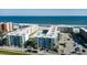 An aerial view of the oceanfront condo community, highlighting its prime location near the ocean at 4151 S Atlantic Ave # 414, New Smyrna Beach, FL 32169