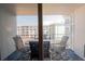 Private balcony with outdoor seating, perfect for enjoying the view of the surrounding property at 4151 S Atlantic Ave # 414, New Smyrna Beach, FL 32169