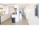 Open concept kitchen and living area with stainless steel appliances and plenty of natural light at 4151 S Atlantic Ave # 414, New Smyrna Beach, FL 32169
