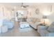 Bright living room with comfortable seating, complemented by a modern kitchen bar and airy ambiance at 4151 S Atlantic Ave # 414, New Smyrna Beach, FL 32169