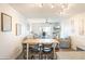 Open-concept living and dining area with balcony access, creating a bright and airy space at 4151 S Atlantic Ave # 414, New Smyrna Beach, FL 32169