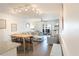 Open living space featuring a comfortable lounge area, dining space and access to a private outdoor balcony at 4151 S Atlantic Ave # 414, New Smyrna Beach, FL 32169