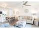 Inviting living room with a large sofa, barstool seating, and stylish decor, creating a cozy atmosphere at 4151 S Atlantic Ave # 414, New Smyrna Beach, FL 32169