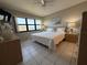 Inviting bedroom with a large window, dresser and views of the ocean at 4175 S Atlantic Ave # 5280, New Smyrna Beach, FL 32169