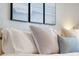 Comfortable bedroom with stylish pillows and soothing artwork above the bed, creating a serene atmosphere at 4201 S Atlantic Ave # 402, New Smyrna Beach, FL 32169