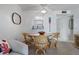 The dining area includes stylish decor and adjoins an archway to the kitchen at 4201 S Atlantic Ave # 402, New Smyrna Beach, FL 32169