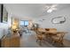 Inviting living room with a ceiling fan, coastal decor, dining area and ocean views at 4201 S Atlantic Ave # 402, New Smyrna Beach, FL 32169