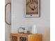 The wall decor in the dining area is a unique mermaid graphic above a small cabinet at 4201 S Atlantic Ave # 402, New Smyrna Beach, FL 32169