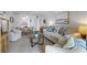 Cozy living room with comfortable seating, stylish decor, and an open layout to the dining area at 4201 S Atlantic Ave # 402, New Smyrna Beach, FL 32169