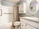 Clean bathroom with a shower-tub combo, vanity, and storage cabinet at 4225 S Atlantic Ave # 218, New Smyrna Beach, FL 32169