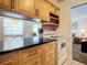 Well-equipped kitchen with modern appliances and a view of the dining area at 4225 S Atlantic Ave # 218, New Smyrna Beach, FL 32169